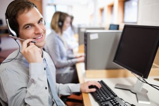 Assistant using a headset in a call center.jpeg