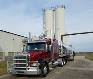 dry-bulk-truck-near-silos-small